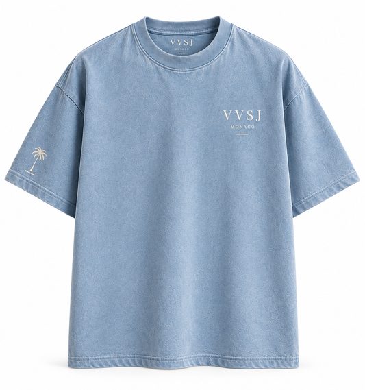 Front of blue VVSJ Monaco graphic T-shirt with chest logo and palm sleeve detail