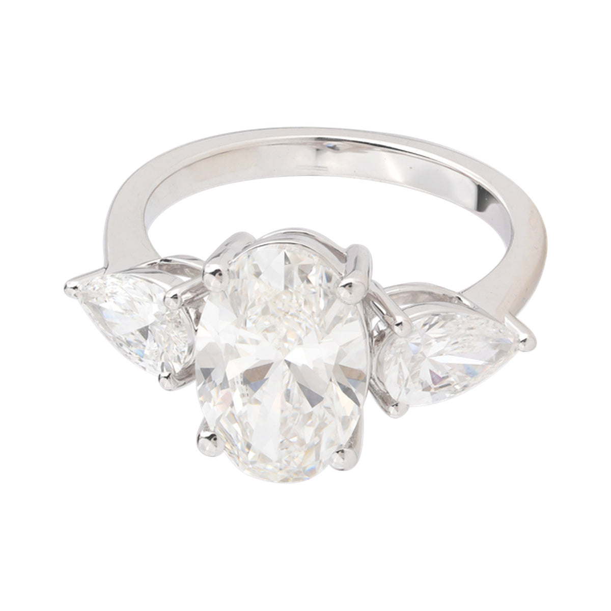 Oval and Pear Three-Stone Ring — authentic catalog photograph on white